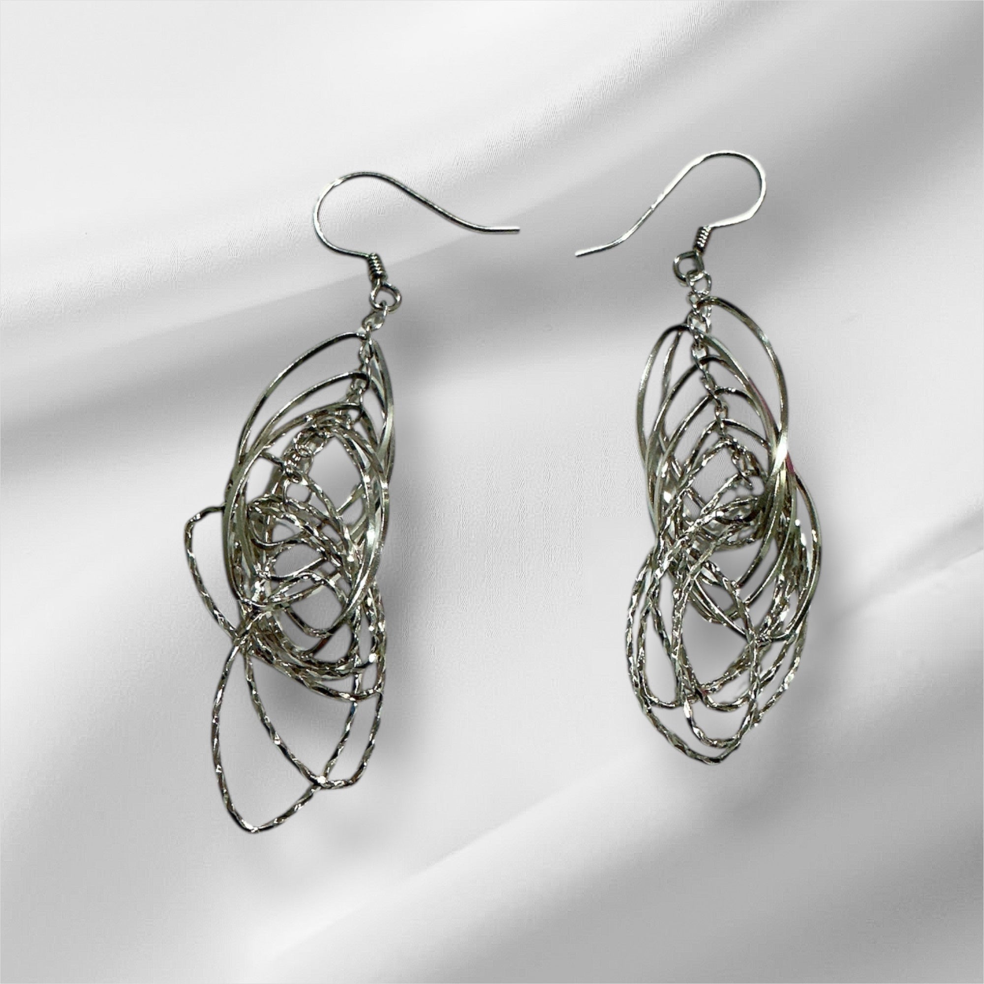 “SPIRAL WHISPER EARRING”