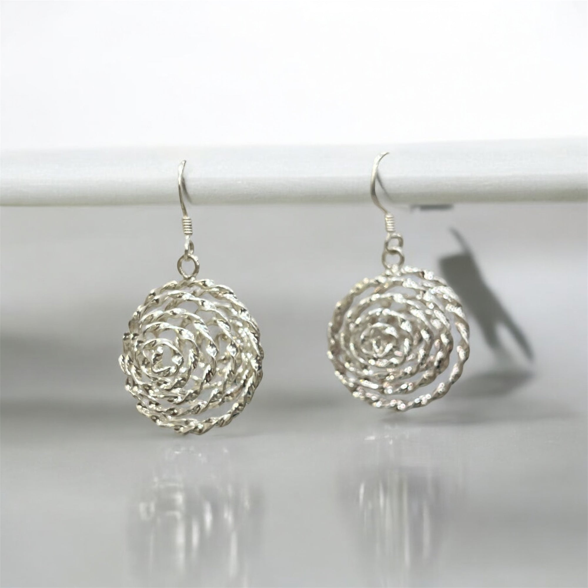 "TWISTED BLOOM EARINGS"