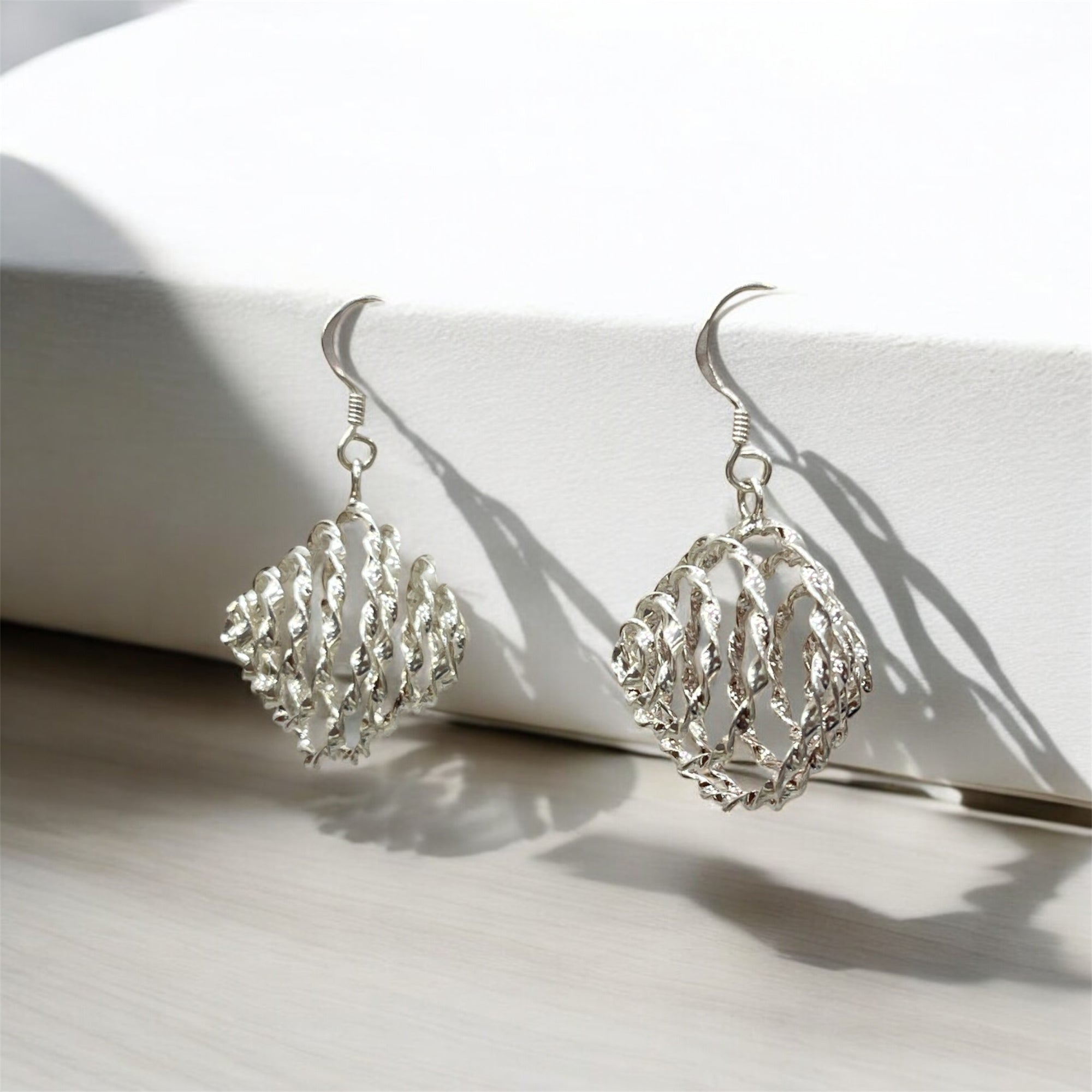 "TWISTED BLOOM EARINGS"